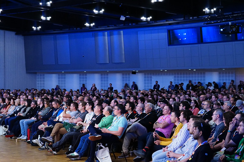 a large group of people sitting in chairs